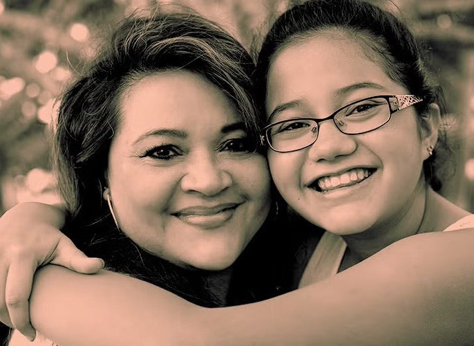 Mom and daughter hugging
