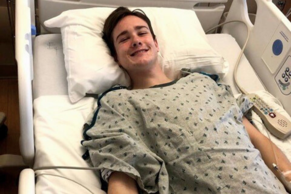 Dan O'Connell smiling in hospital bed