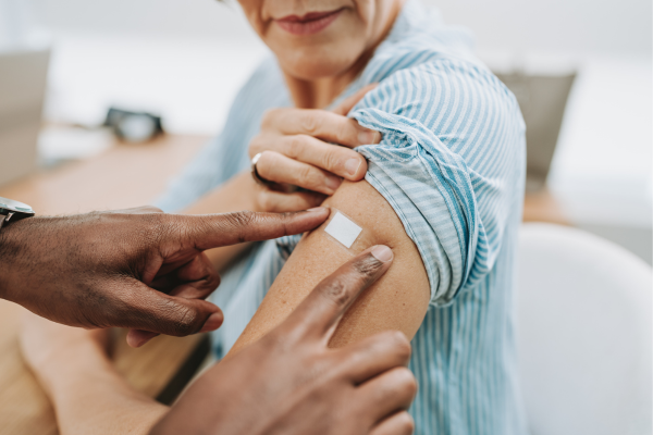 Older adult getting a vaccine.
