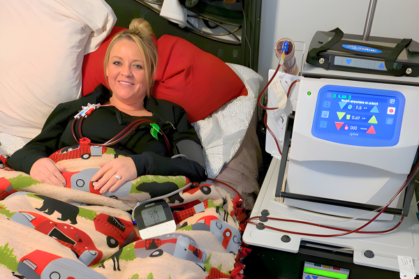 Comfy person in bed receiving home hemodialysis