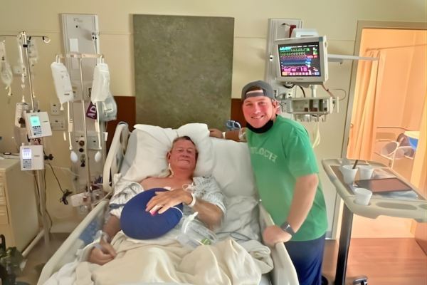 Bobby in hospital bed with Trevor