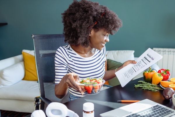 Happy person reviewing nutrition guidance