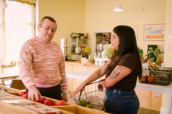 Couple grocery shopping together