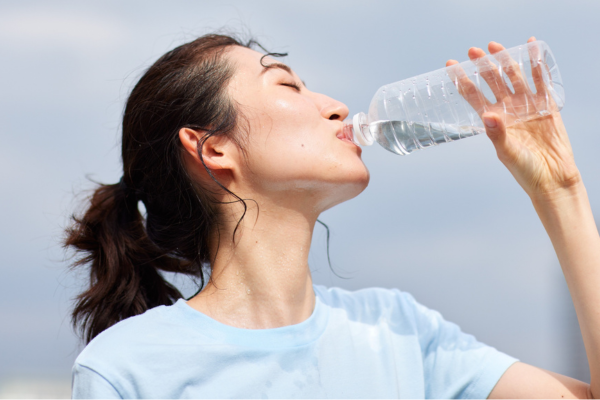 Sweaty person drinking water
