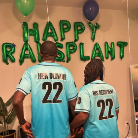 Two people wearing donor/recipient jerseys