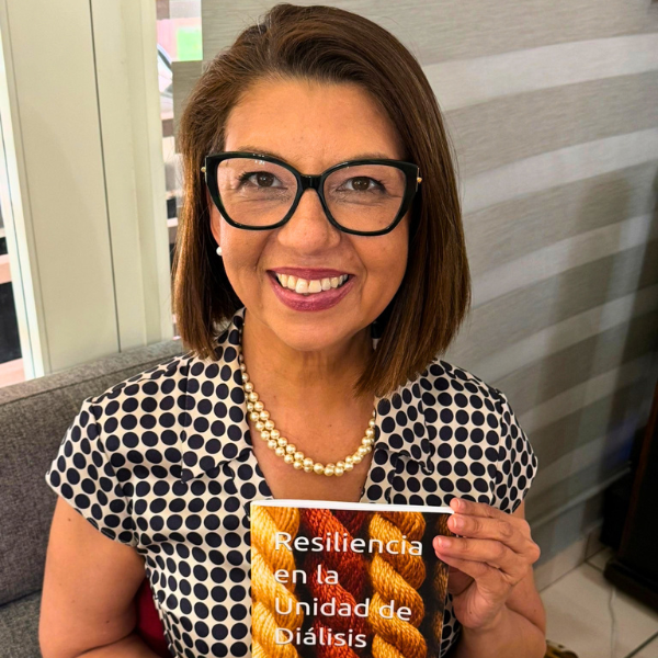 Dr. García Echevarría holding her book