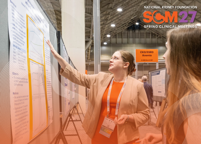 Two professionals reviewing an abstract at the Spring Clinical Meetings. 