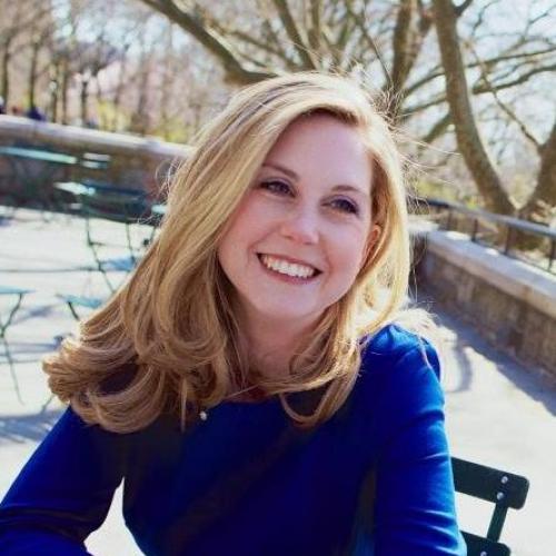 Alyssa Franklin Murray, a white woman with blonde hair, sitting on a patio outdoors in the sunshine