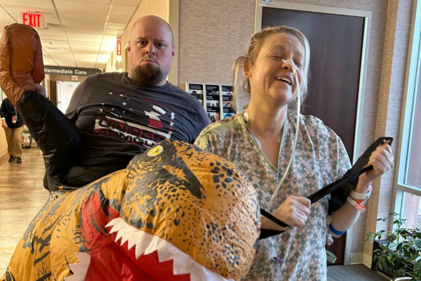 Michael dressed up as a dinosaur to cheer up Christine in hospital