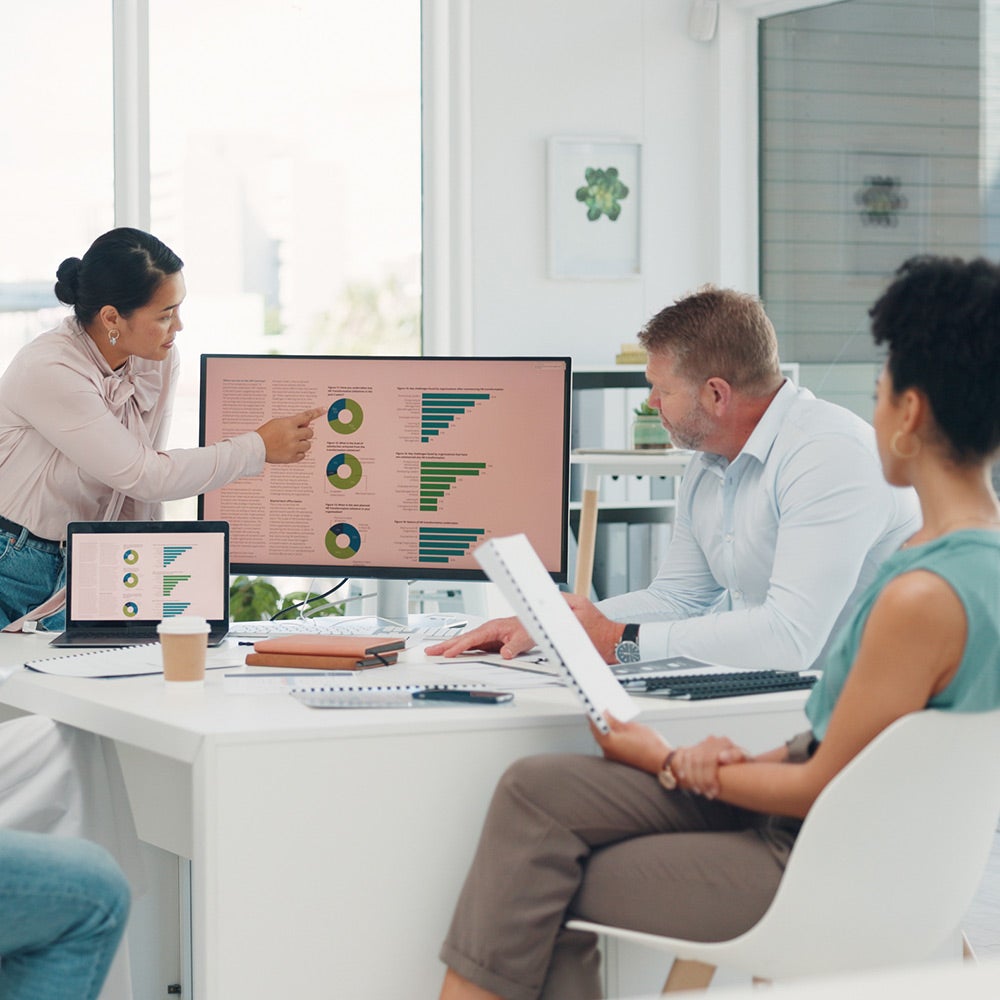 Group of health care professionals reviewing data at a table