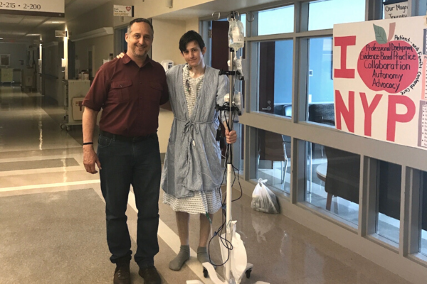 Andrew and dad standing in hospital