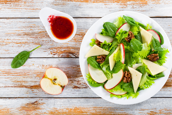 Apple cranberry walnut salad with dressing on the side