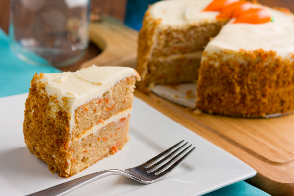 Slice of carrot cake on a plate.