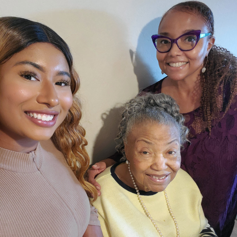 Charlotte next to mom and daughter