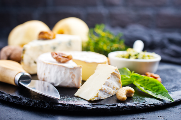 Cheese and herb spread on charcuterie board