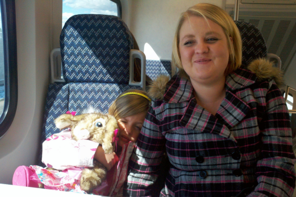 Christina and her daughter on a travel bus