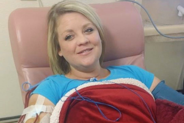 Christina smiling while receiving in-center hemodialysis