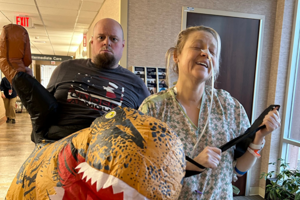 Michael dressed up as a dinosaur to cheer up Christina in hospital