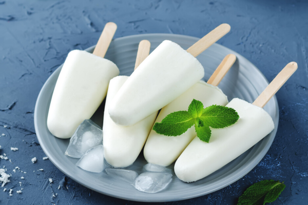 Creamy Piña Colada Popsicles in a bowl