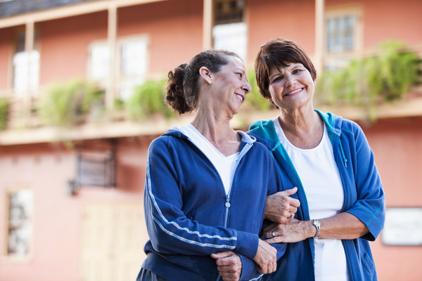 Two people holding each other during a walk