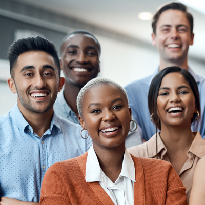 Diverse group of people smiling in an office