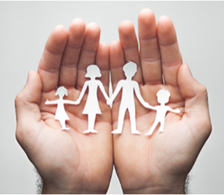 a pair of hands holding a paper cutout of a family.