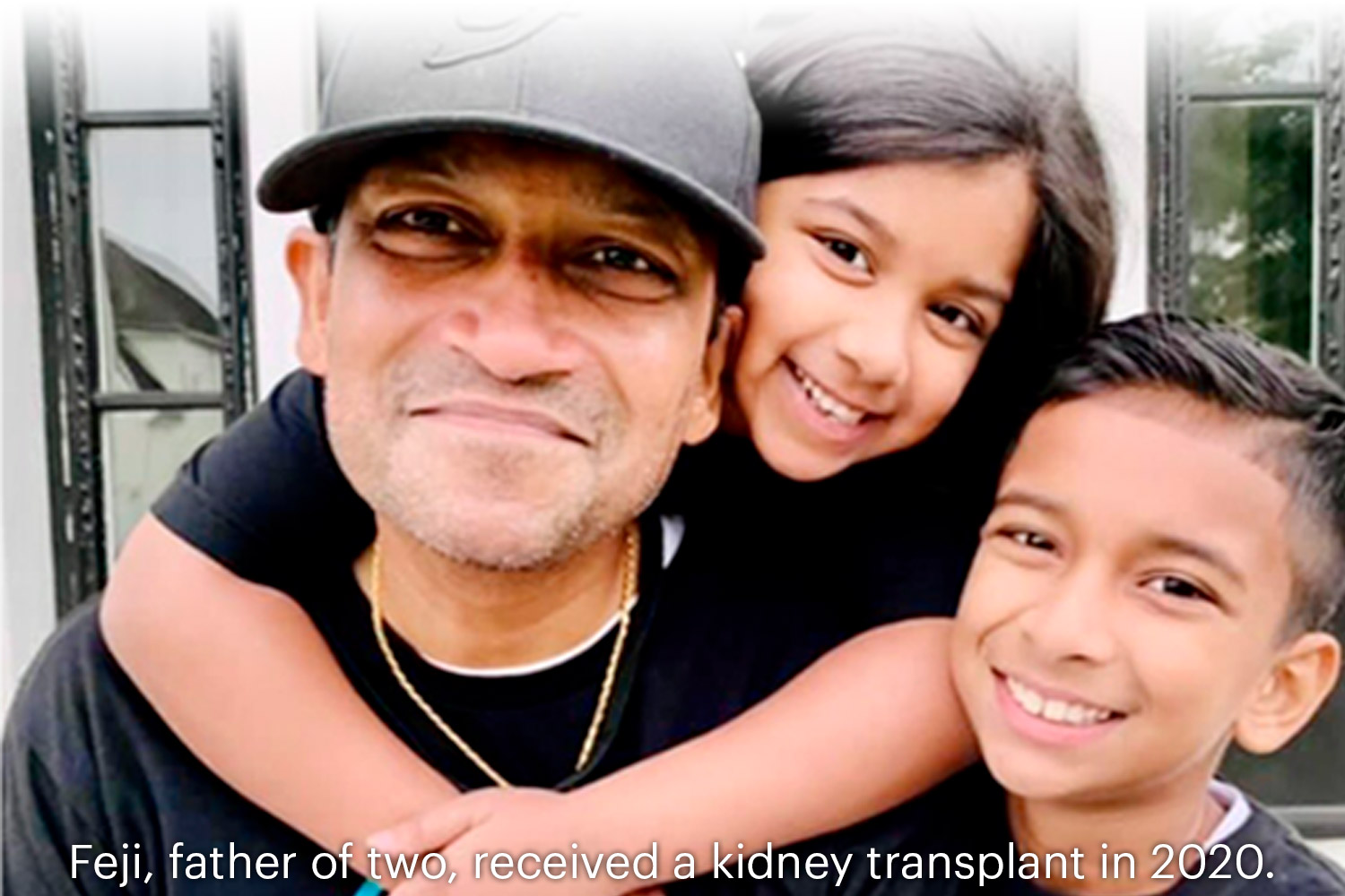 Feji posing with his young children. Feji received a kidney transplant in 2020.