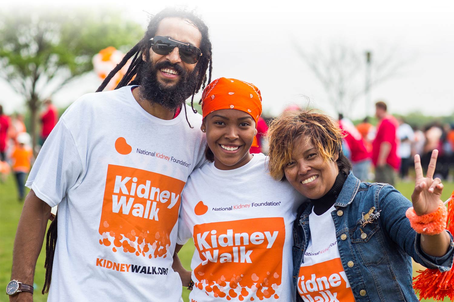 Three Kidney Walk participants smiling at a Walk event