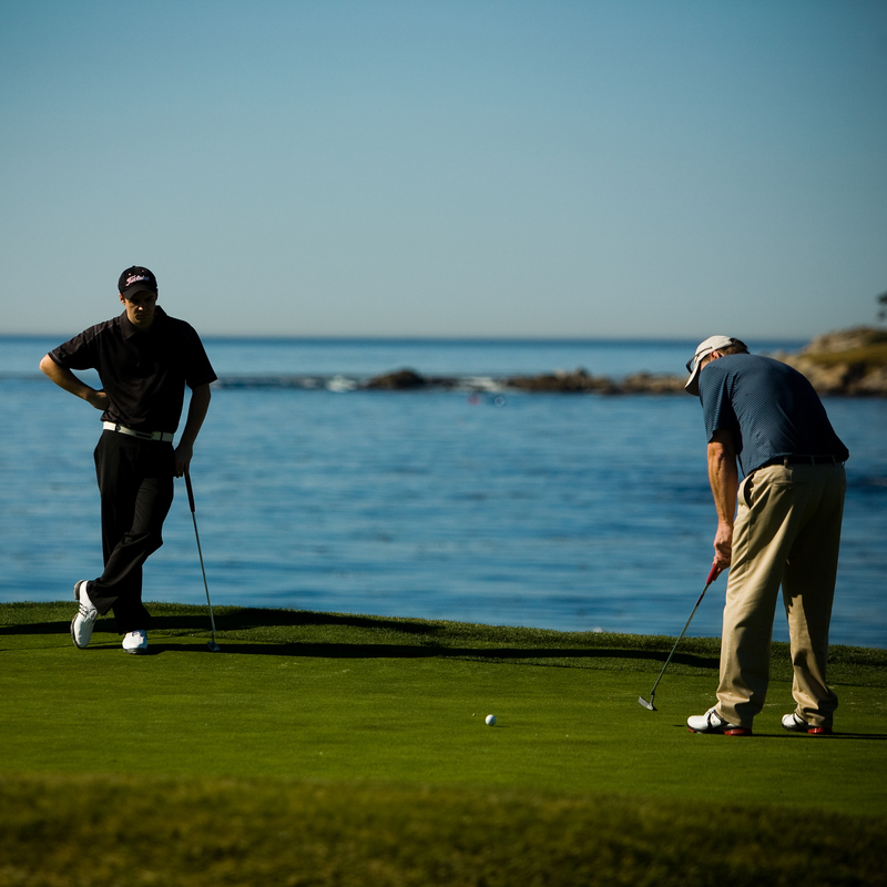Golfers golfing at Pebble Beach Golf Course