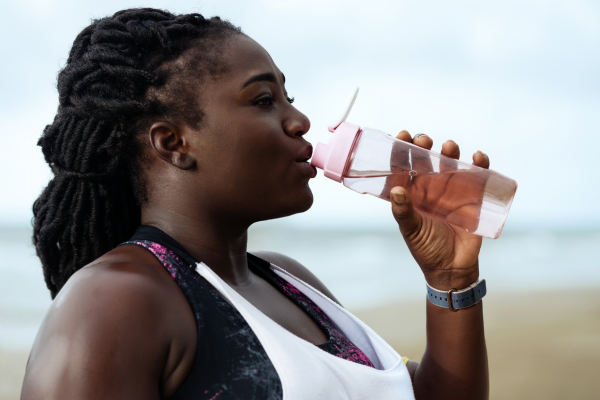 Person drinking water after exercise