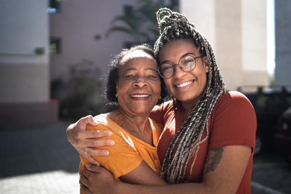 Woman and mother smiling and hugging