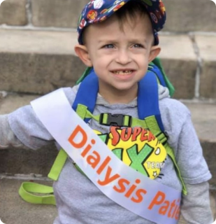 call for research grant proposals 2021 Jax, a small child, wears a "Dialysis Patient" sash