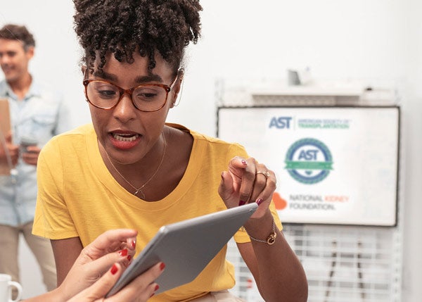 Woman signing up on a tablet