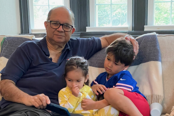 Kam Shenai with his grandchildren