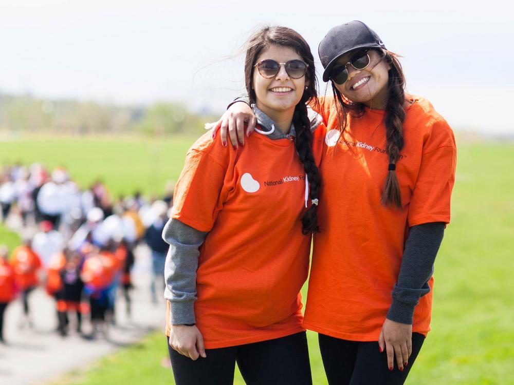 Two girls posing near a kidney walk