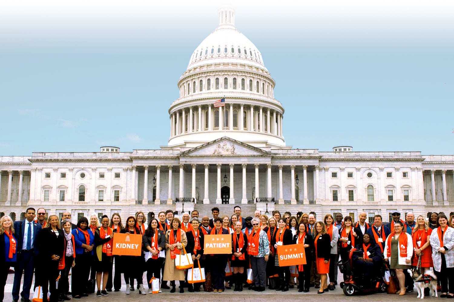 Three advocates at the US Capitol holding Kidney Health NOW signs