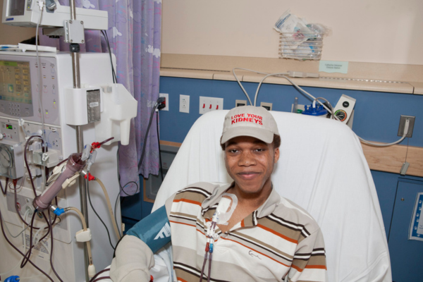 Person smiling while on dialysis