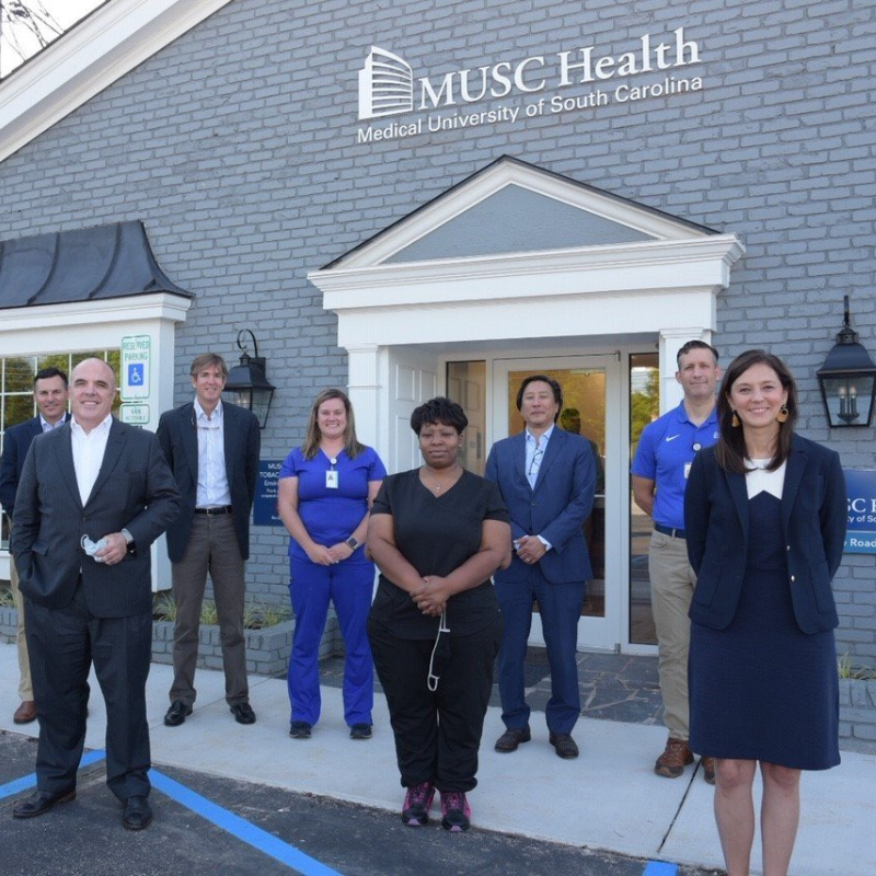 Musc staff outside building