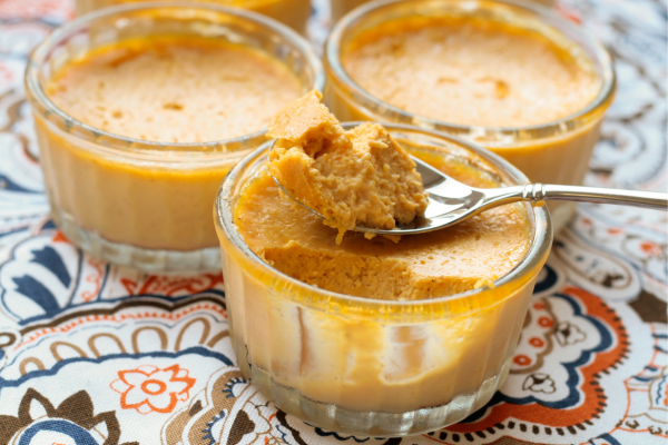 Three pumpkin maple custards in glass cups