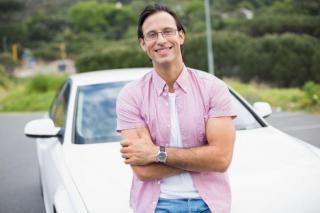 man in front of a car 