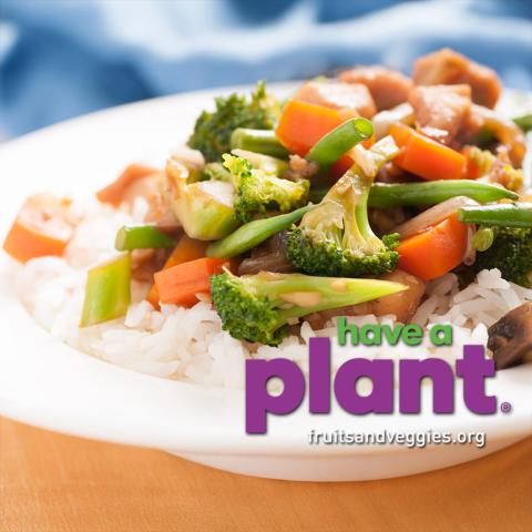 chicken and mixed vegetable stir fry over rice, have a plant logo