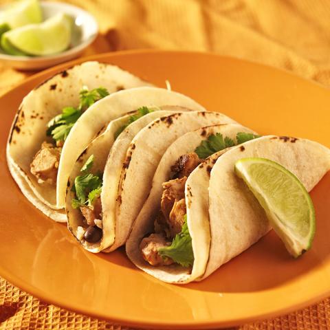 Chicken Tacos with lime wedges
