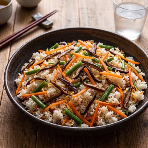 Japanese-style sushi rice with julienned vegetables and shiitakes over the top