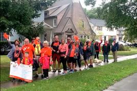 Group of family and friends doing a community Kidney Walk in a residential neighborhood