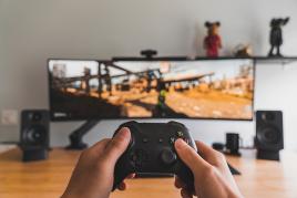 Person playing a video game in their living room