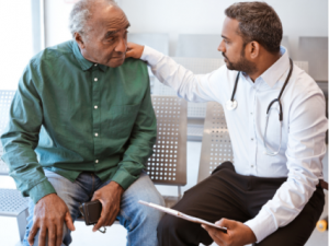 Older patient speaking with doctor