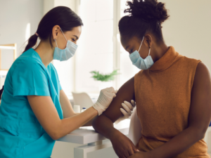 Person getting arm disinfected for flu shot