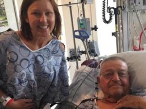 Kelli smiling next to her father after paired kidney exchange
