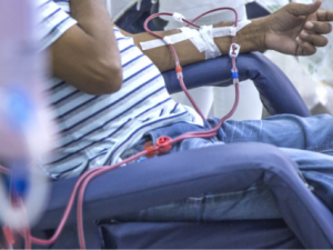 Person hooked up to dialysis machine in center