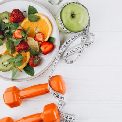 healthy food plate and weights 